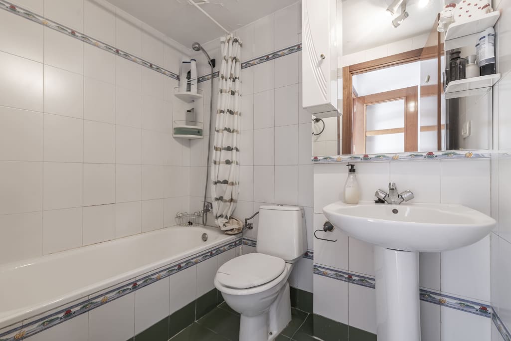 small bathroom keeping original plumbing layout