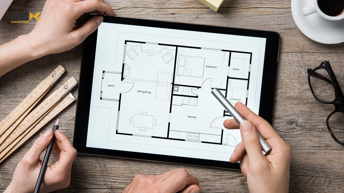 architect drawing a Melbourne home extension on a tablet