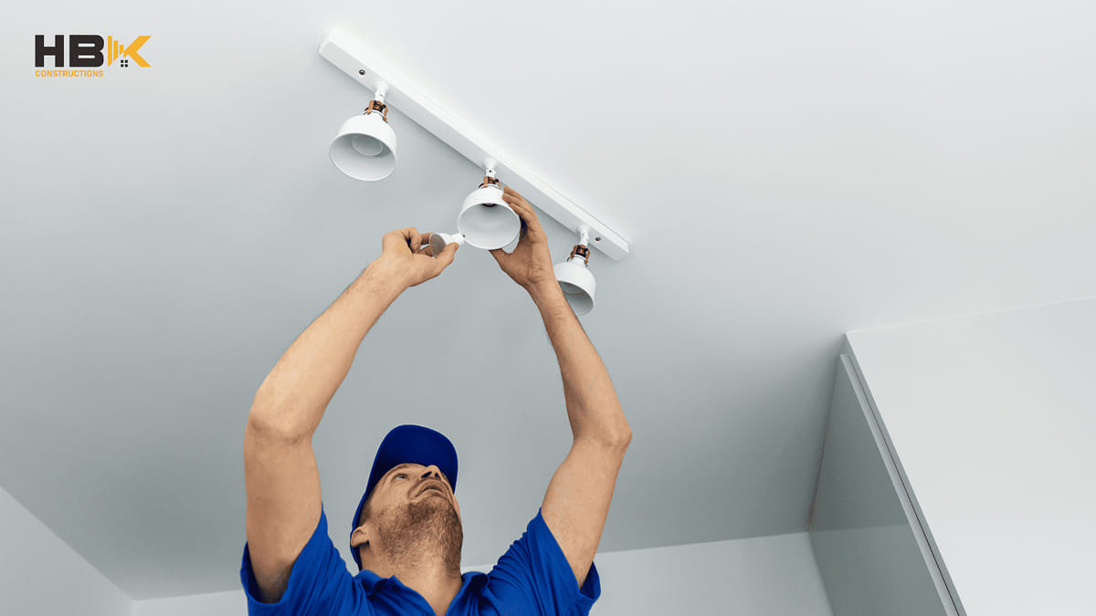 electrician installing kitchen lighting in a Melbourne renovation